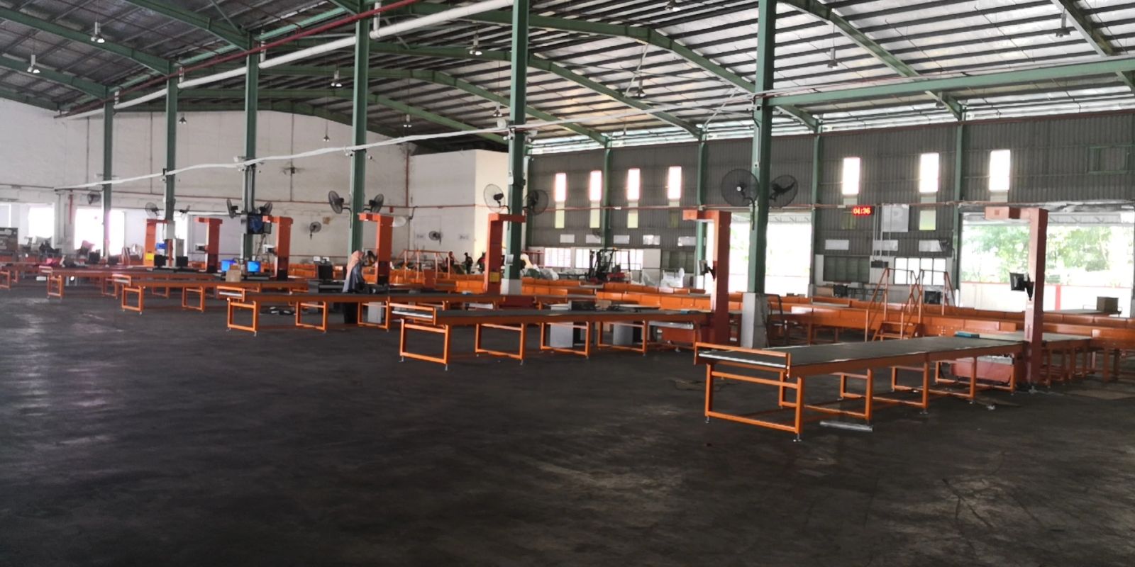 Courier sorting hall with packing and sorting workbenches laid out along the parcel flow